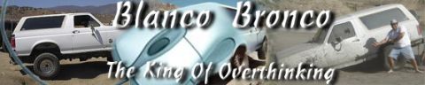 1996 Ford Bronco - A pair of 1996 Ford Broncos are shown, one navigating a dusty trail while the other is mired in mud, with a person attempting to push it fr…