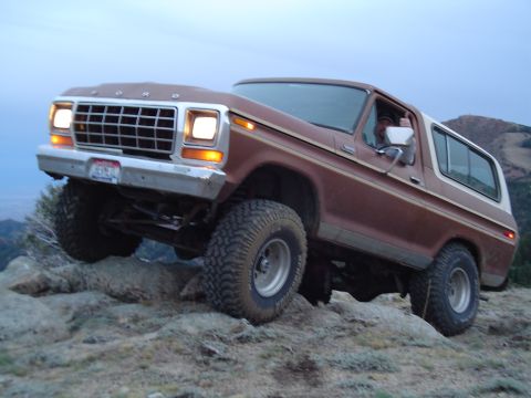 1978 Ford Bronco - This 1978 Ford Bronco navigates a rocky incline, its off-road capabilities.