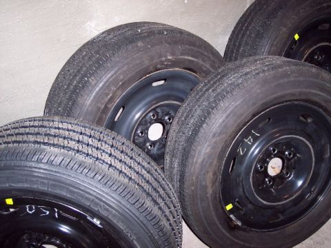 2001 Ford Crown Victoria - A collection of spare tires, likely for a vehicle, are shown in this close-up view.