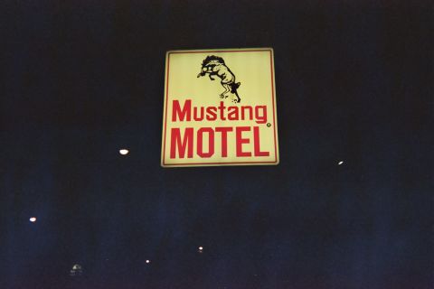 1968 Ford Mustang - Sign for the Mustang Motel, a horse graphic and red lettering.