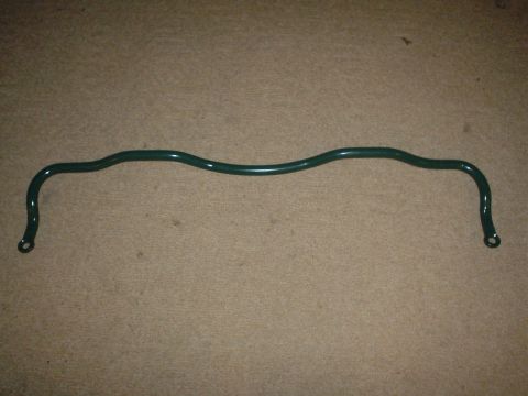 1993 Ford Taurus - A green sway bar is shown against a carpeted background.