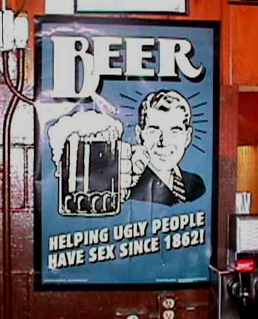 2003 Jeep TJ - A humorous poster advertising beer is displayed on a wall.