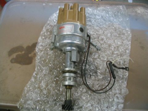 1969 Ford Mustang - Automotive distributor part shown on bubble wrap, no vehicle visible.
