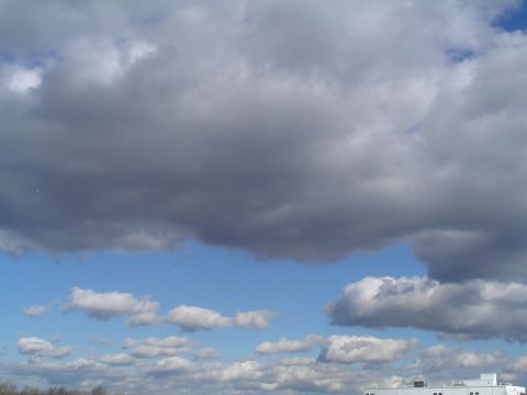 1990 Ford Bronco - The image shows a sky filled with clouds, with a watermark for Supermotors.net at the bottom.