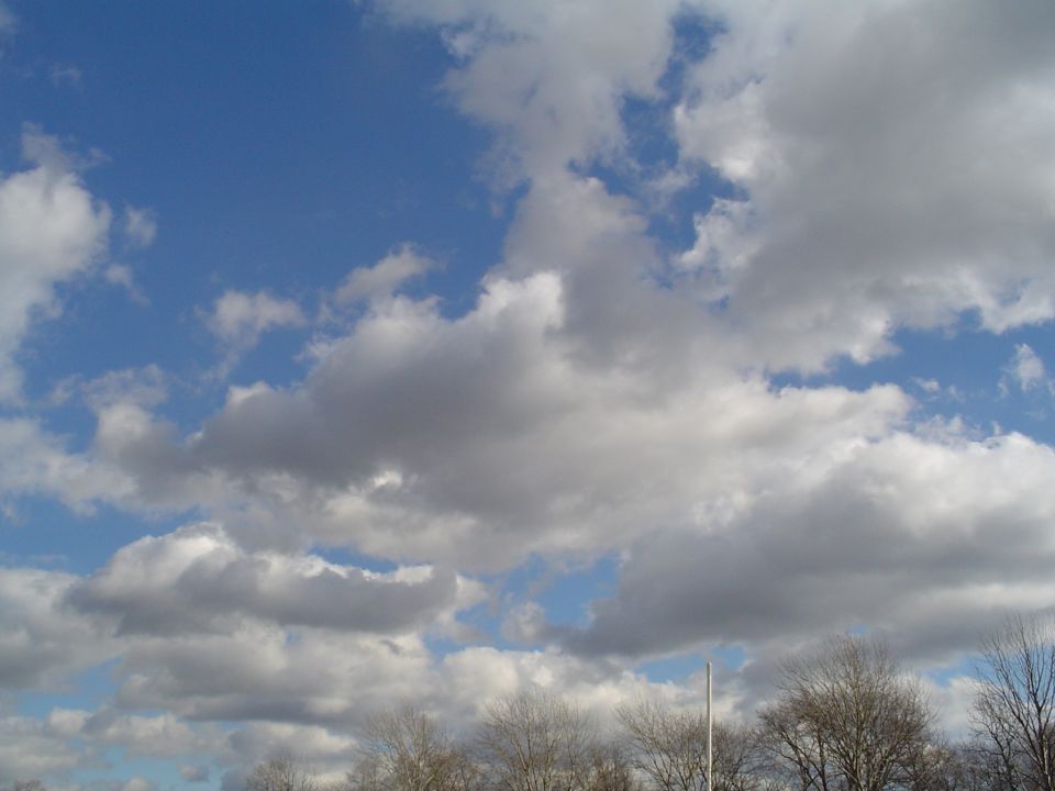 Sky with clouds and bare trees, SUPERMOTORS logo at bottom right