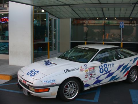 1990 Ford Probe - 1990 Ford Probe SCCA Racer in front of Autobacs