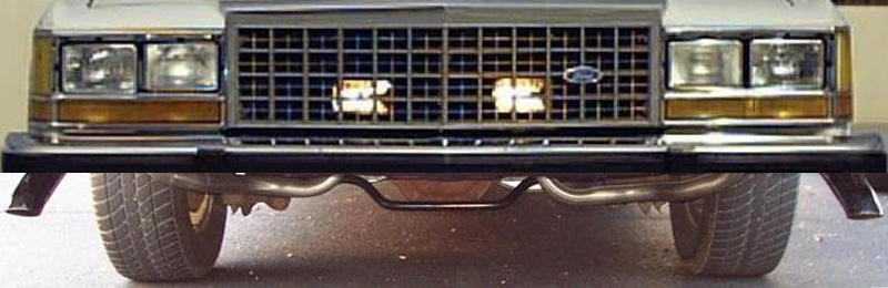 Front view of a 1985 Ford Crown Victoria LTD's grille and headlights