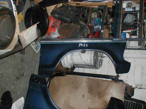 1979 Ford Bronco - Car fender part with handwritten text 'PASS' and a fan inside the wheel well.