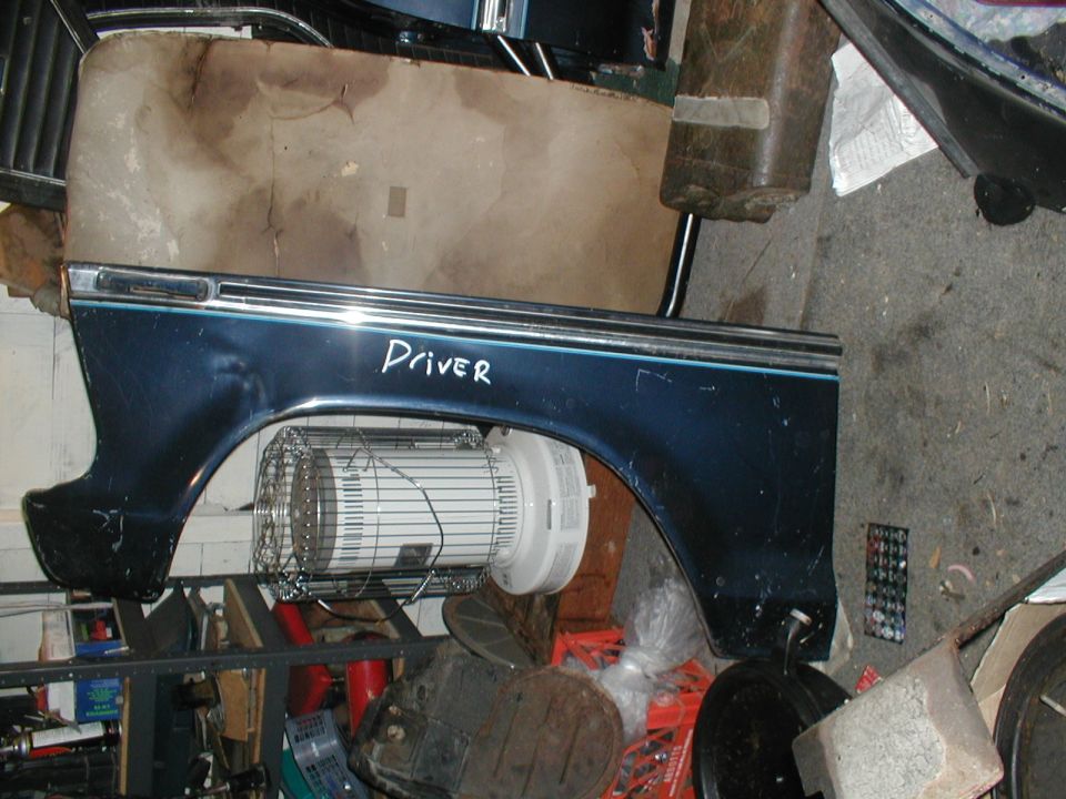 Dark blue fender with chrome trim and a blue stripe, labeled "Driver"
