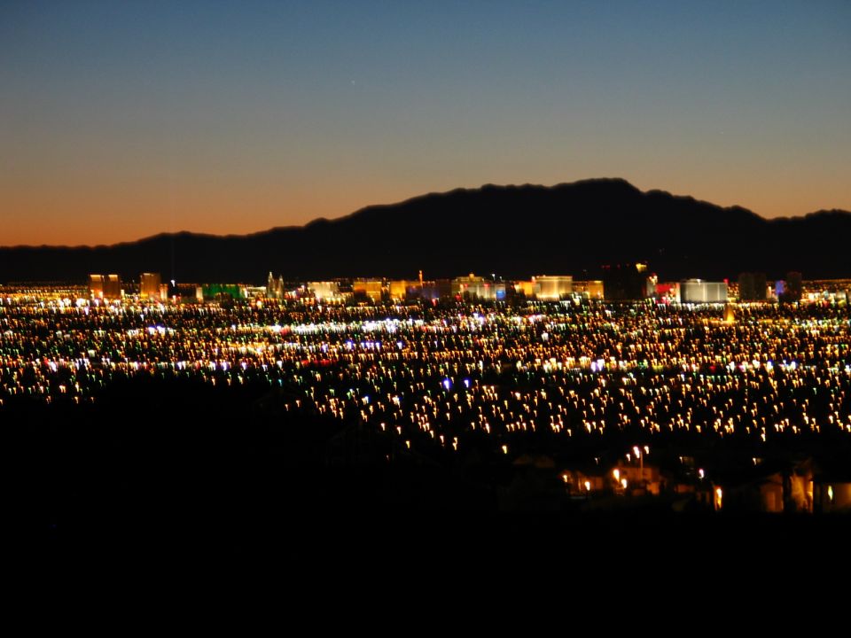 Las Vegas strip skyline at dusk with mountains in background
