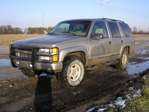 2000 Chevrolet Tahoe - This 2000 Chevrolet Tahoe is equipped with a brush guard and seen parked on a wet, muddy road.