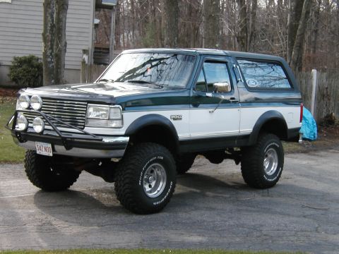 1994 Ford Bronco - This lifted Ford Bronco features a two-tone paint scheme and off-road modifications.