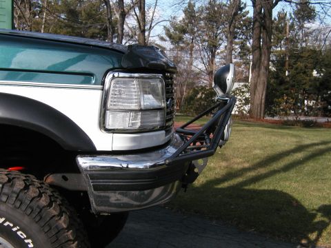 1994 Ford Bronco - Front view of a 1994 Ford Bronco a custom bumper and auxiliary lights.