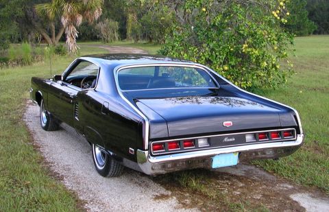 1969 Mercury Marauder - Rear view of a black 1969 Mercury Cougar with a distinctive taillight design.
