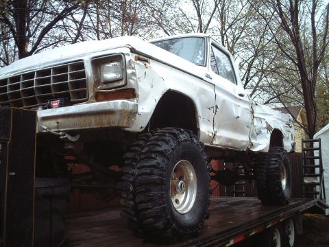 1979 Ford F-150 - This heavily modified 1979 Ford F-150 pickup truck is loaded onto a trailer.