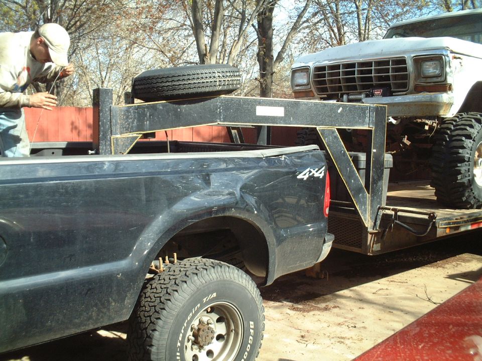 Front view of a white 1979 Ford pickup truck on a trailer