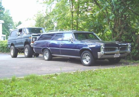 1967 Pontiac Tempest - A 1967 Pontiac Tempest station wagon is parked behind a Ford Bronco.