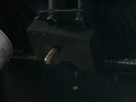 1979 Ford Bronco - Close-up view of a threaded bolt on an engine mount.
