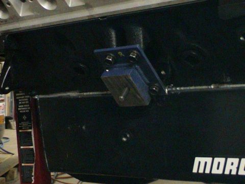 1979 Ford Bronco - Close-up of an engine block showing a bolted bracket and mounting hardware.