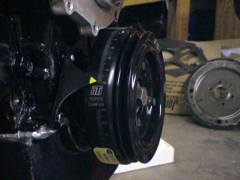 1979 Ford Bronco - Close-up of an engine's ATI Super Damper pulley, showing timing marks and a yellow pointer.