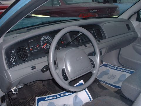 1999 Ford Crown Victoria - Interior view of a 1998 Ford Crown Victoria, with another vehicle visible outside.