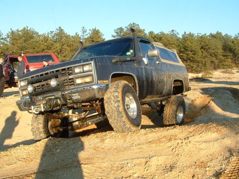 1994 Ford Bronco - This lifted SUV navigates a sandy trail with a snorkel kit installed.