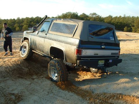 1994 Ford Bronco - Chevrolet K5 Blazer with aftermarket bumper and snorkel navigates sandy off-road conditions.