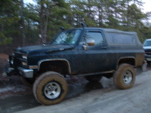 1994 Ford Bronco - This lifted SUV is equipped for off-road adventures, a snorkel and aggressive tires.