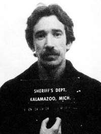 1983 Ford Bronco - Black-and-white booking photograph of a mustachioed man holding an ID placard reading "SHERIFF'S DEPT. KALAMAZOO, MICH." with a booking num…