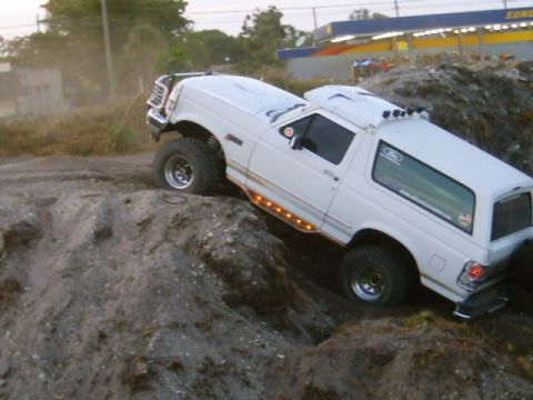 1995 Ford Bronco - This 1995 Ford Bronco is navigating a challenging off-road terrain.