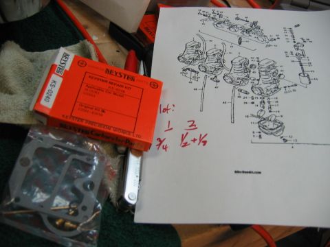 1985 Ford LTD Crown Victoria - A Keyster carburetor repair kit and diagram are laid out on a surface, suggesting a repair or maintenance task.