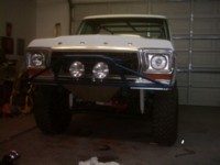 1978 Ford Bronco - Front view of a 1978 Ford Bronco modified with a custom bumper and auxiliary lights.
