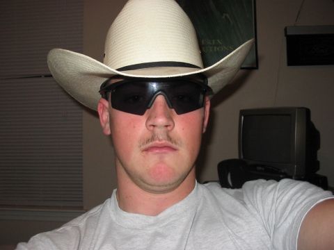 1988 Ford Bronco - A man poses for a selfie while wearing a cowboy hat and sunglasses.