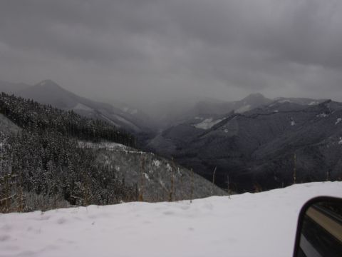 1991 Ford Bronco - View of a vast, snow-covered mountain valley under a cloudy sky.