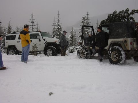 1991 Ford Bronco - Two off-road vehicles are stuck in the snow during a winter outing.