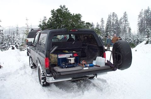 1995 Ford Bronco - X-mas tree loaded, hanging out having a great time, heating up some Hot Chocolate on the camp stove.