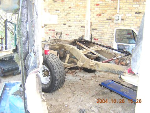 1984 Chevrolet Blazer - The frame and chassis of a 1984 Chevrolet Blazer, with the front tire and suspension components visible.