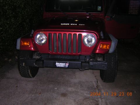 1984 Chevrolet Blazer - This red Jeep Wrangler has a 'Bush Cheney 04' sticker on its front bumper.