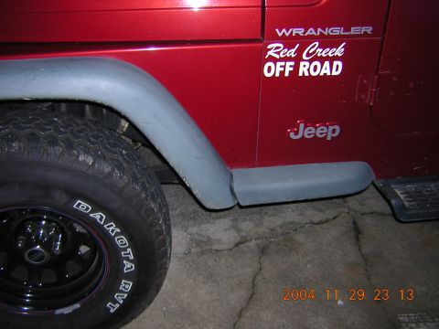 1984 Chevrolet Blazer - A red Jeep Wrangler is shown from the side, a 'Red Creek OFF ROAD' decal and a Dakota RVT tire.