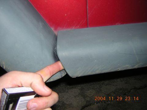 1984 Chevrolet Blazer - A hand points to a gap in the interior paneling of a vehicle.