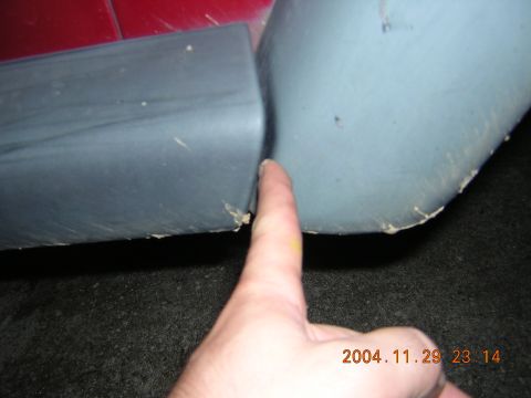 1984 Chevrolet Blazer - Close-up of a panel gap on a vehicle's lower body, with a finger indicating the separation.