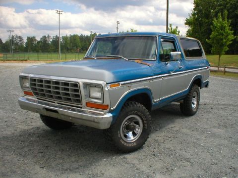 1978 Ford Bronco - This 1978 Ford Bronco features a distinctive two-tone blue and silver paint scheme and a prominent front grille.