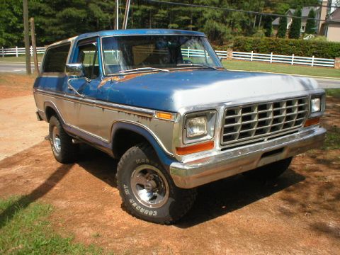 1978 Ford Bronco - This 1978 Ford Bronco is parked outdoors on a dirt and grass area.