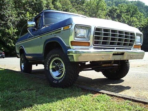 1978 Ford Bronco - This 1978 Ford Bronco is shown from a 3/4 front angle, a two-tone blue and silver paint scheme.