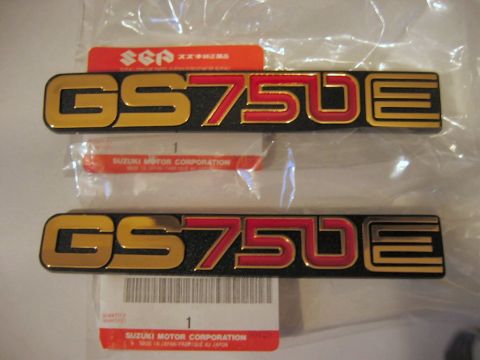 1985 Ford LTD Crown Victoria - New Suzuki GS750E emblems still in original packaging with manufacturer labels.