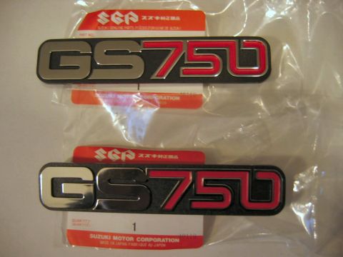 1985 Ford LTD Crown Victoria - Two new Suzuki GS750 emblems are shown still in their original packaging with manufacturer information.
