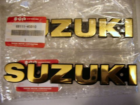 1985 Ford LTD Crown Victoria - Pair of Suzuki emblems, one showing part number 68111-45010.