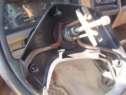 1983 Ford Bronco - A cheap puller makes the job easier, but the wheel can usually be removed by hooking your knees behind it and tapping on the pre-loosened n…