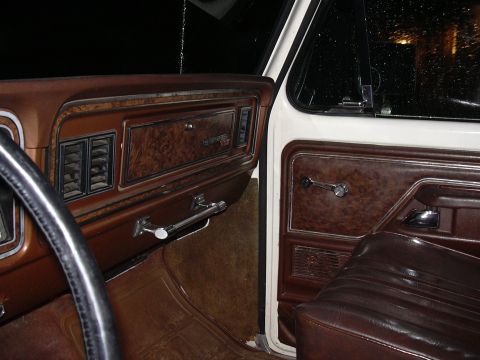 1978 Ford Bronco - Interior view of a 1978 Ford Bronco, highlighting the dashboard and door panel details.