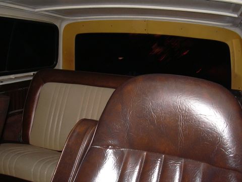 1978 Ford Bronco - The interior of a 1978 Ford Bronco shows its classic brown leather and beige seats.